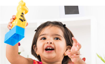 preschool girl playing with legos