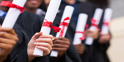 people holding diplomas