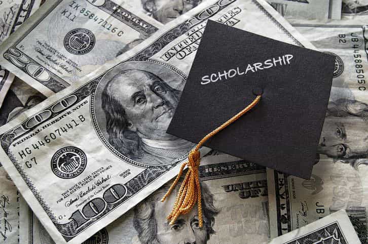 graduation cap that says scholarship