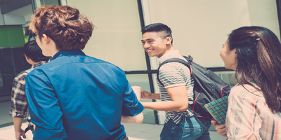 group of teenagers with backpacks