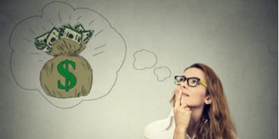 Woman thinking of a bag of money