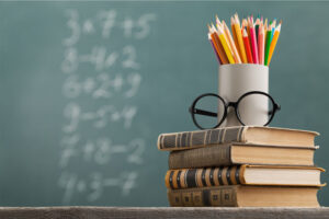 Stack books and pencils in classroom